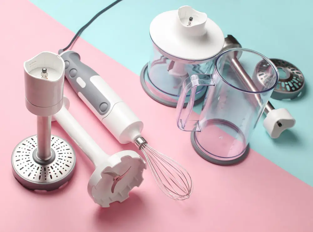 a collection of accessories for an electric whisk