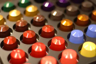 A collection of colour-coded coffee pods