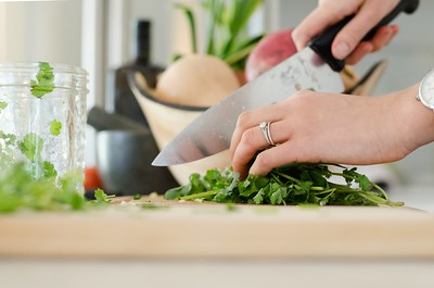 a-pair-of-hands-chopping-some-greens