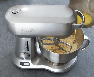 a kitchen equipment with various ingredients inside the bowl