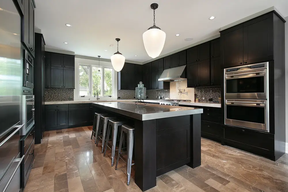 A dining area with dark wood cabinetry